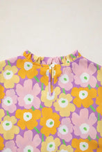 A vibrant purple floral print puff sleeve blouse with cheerful yellow and pink blossoms and green stems