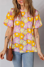 Floral print puff sleeve blouse in yellow and pink on lavender with short puffed sleeves and ruffled cuffs