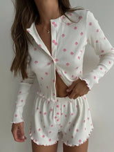 White ribbed pajama set with pink floral print and scalloped hems