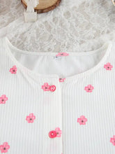 White ribbed blouse with pink floral embroidery in lounge set