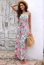 Floral print round neck sleeveless maxi dress with bell hem and pockets