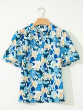 Blue and cream floral print short puff sleeve v neck blouse with ruffled sleeves and gathered neckline