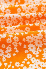 Orange floral print smocked V neck maxi dress with white flowers