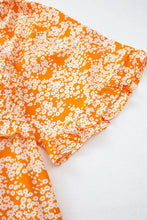 Orange floral print smocked V neck maxi dress with daisy shorts