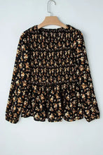 Black floral print long sleeve blouse with floral print smocked waist and smocked detailing for elegant wear