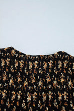 Black floral print smocked waist long sleeve blouse with delicate beige and tan floral print on fabric