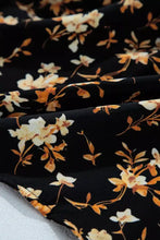Black floral print smocked waist long sleeve blouse with delicate cream and golden orange floral print fabric