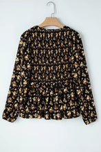 Black floral print smocked waist long sleeve blouse with peplum hem in lightweight fabric for elegant wear