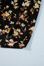Black floral print smocked waist long sleeve blouse with delicate cream and gold floral pattern design