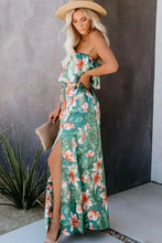 Green floral strapless maxi dress with high slit, belt, and tropical vibes