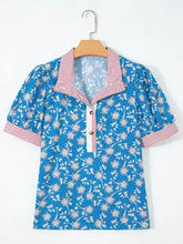 Blue floral print short-sleeved blouse with red and white striped trim button neck and cuffs for casual wear