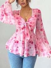 Pink floral print chiffon blouse with bell sleeves front bow and peplum hem perfect for casual wear