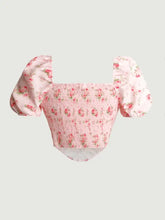 Pink floral print crop top with puff sleeve design and smocked bodice for a stylish summer look