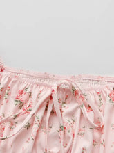 Pink floral pajama pants with soft lightweight fabric and elastic waistband paired with puff sleeve blouse