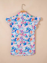 A vibrant floral print tie v neck blouse with ruffle short sleeves in pink blue white green and orange shades