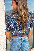 Blue floral print puff sleeve blouse with neck pleated detail and fitted silhouette in lightweight fabric