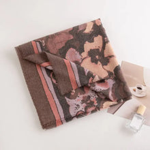 Printed raw hem polyester scarf in brown and pink floral pattern with fringe edges