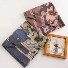 Two printed raw hem polyester scarves with floral print