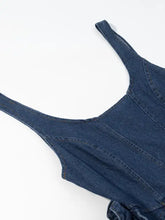 Blue denim floral ruffle layered dress with thin straps and fitted design in a ruffle layered denim style