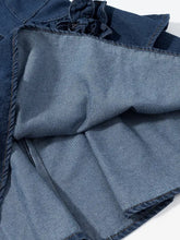Denim skirt with ruffled neckline and visible stitching details in a floral ruffle layered denim dress design