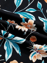 Floral short bubble sleeve blouse with notched neck in black fabric featuring turquoise leaves and peach-colored flowers
