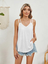 White florira cutout eyelet tank with v-neckline, spaghetti straps, and side pockets in eyelet fabric
