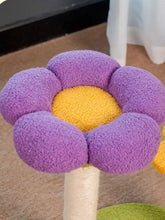 Purple and yellow plush flower-shaped cat tree top with scratching post