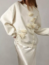 Cream-colored flower dropped shoulder sweatshirt with 3d embroidered white floral appliqués on front and side