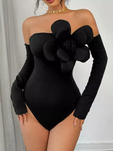 Black off-the-shoulder long sleeve bodysuit with large 3d floral embellishment on chest for elegant wear
