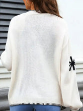 Flower pattern open front knit cardigan in cream with black star sleeve
