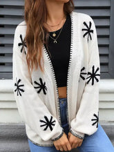 Flower pattern open front knit cardigan with black starburst and ribbed trim