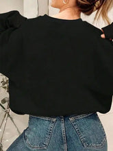 Black flower round neck long sleeve sweatshirt with colorful grid pattern