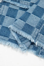Blue and light blue checkered denim mini dress featuring frayed hem edges with plaid pattern and denim fabric texture