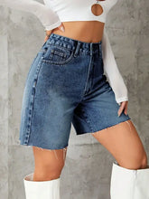 High-waisted frayed hem denim shorts with raw edges