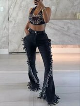 Black fringe flare jeans with a distressed textured finish featuring a frayed hem and raw hem detailing