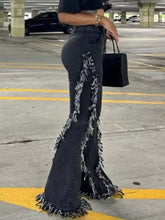 Black frayed trim high waist flare jeans with raw hem and distressed textured finish in denim material