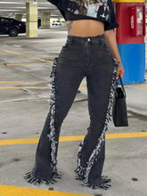 Dark wash denim flare jeans with frayed hem and textured raw hem detailing along the sides and bottom