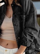 Free People black distressed denim jacket with frayed hem and pockets