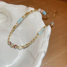 Multicolored freshwater pearl beaded necklace with gold accents