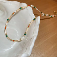 Delicate freshwater pearl beaded necklace with white, green, orange beads