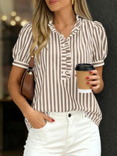 A stylish frill striped puff blouse with vertical brown and white stripes, ruffled collar, and button-down front