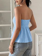 Light blue frill tube top with smocked strapless design, buckle detail, peplum hem, and gathered waistband