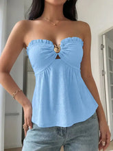 Light blue textured strapless frill tube top with gold-toned bow buckle detail at center front