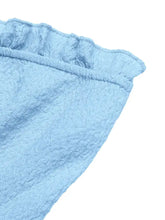 Light blue textured frill tube top with buckle detail featuring a ruffled hem for stylish summer wear