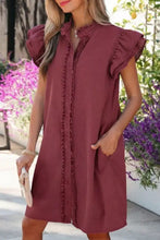 A soft dusty rose frilled detail button down ruffle short sleeve denim mini dress with button front design