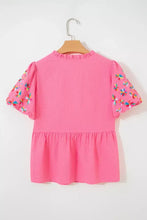 A vibrant pink peplum top with neck flower embroidered puff short sleeves and colorful butterfly embroidery