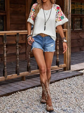 Fringe round neck white T-shirt with floral half sleeve embroidery