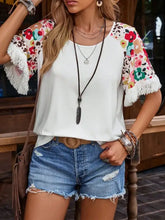 White fringe round neck T-shirt with floral half sleeve and denim shorts