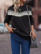 Black crew neck fringe trim sweatshirt with white geometric embroidery and machine wash care instructions