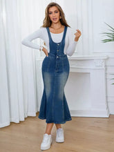 Blue denim overall dress with front-button closures, fitted flared skirt, slightly stretchy fabric, machine wash cold safe